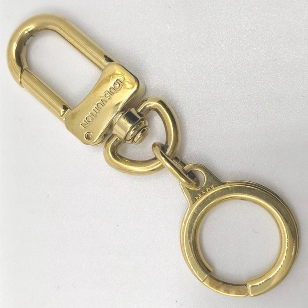 Authentic Louis Vuitton Key Ring , Bag Charm-and Strap Extender all in one.